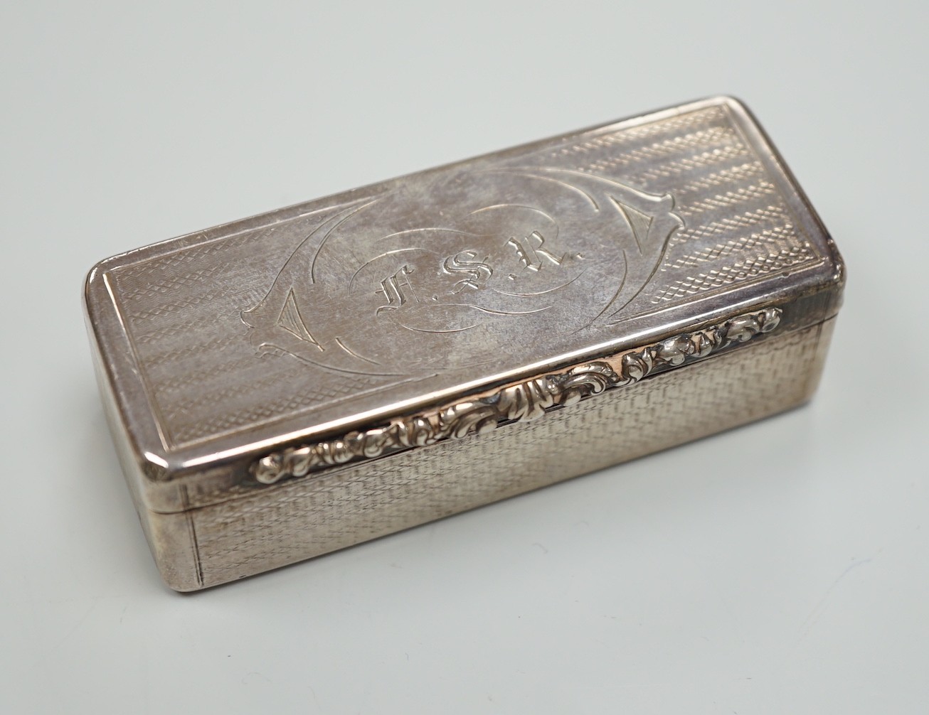 An early Victorian engine turned silver rectangular snuff box, Edward Smith, Birmingham, 1843, 77mm, with engraved initials.